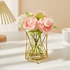 Metallic gold table flower vase with pink and white flowers