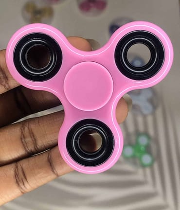 pink plastic fidget spinner from rubeecharms
