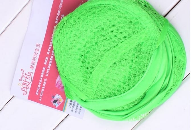 green folded laundry mesh bag