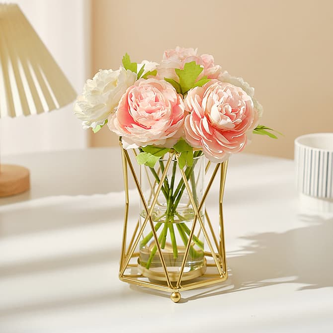 Metallic gold table flower vase with pink and white flowers