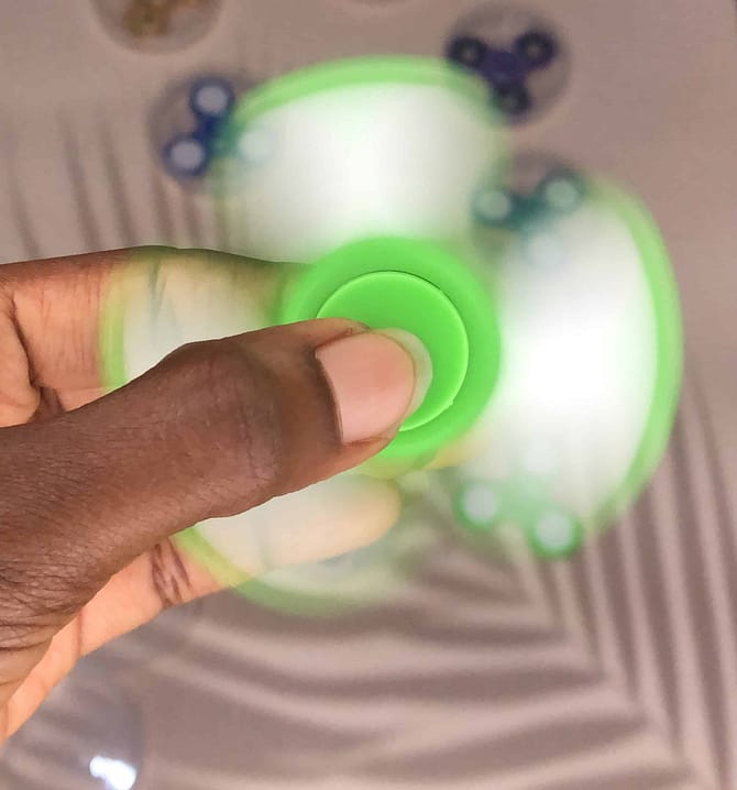 spinning green fidget spinner