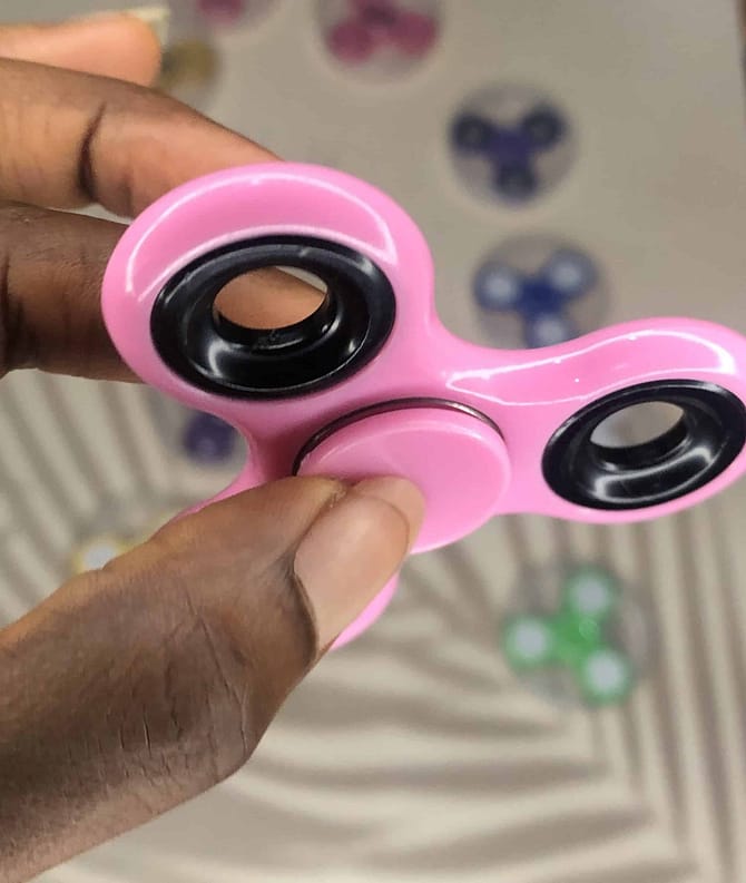 glowing pink fidget spinner