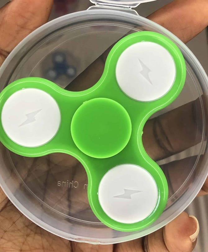 green plastic fidget spinner from rubeecharms in abuja