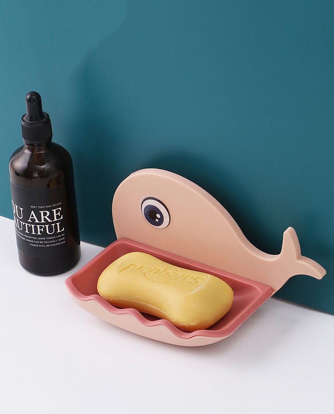 pink fish-shaped soap holder on a table